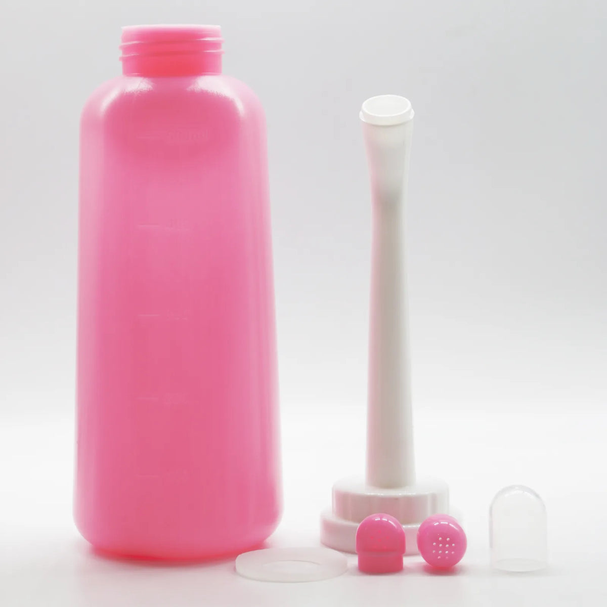 Alle Teile: Flasche, Sprühkopf, Dichtungsring, zwei weiche Aufsätze und Schutzkappe